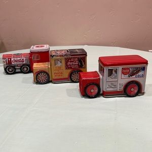 Three Coca-Cola Tins